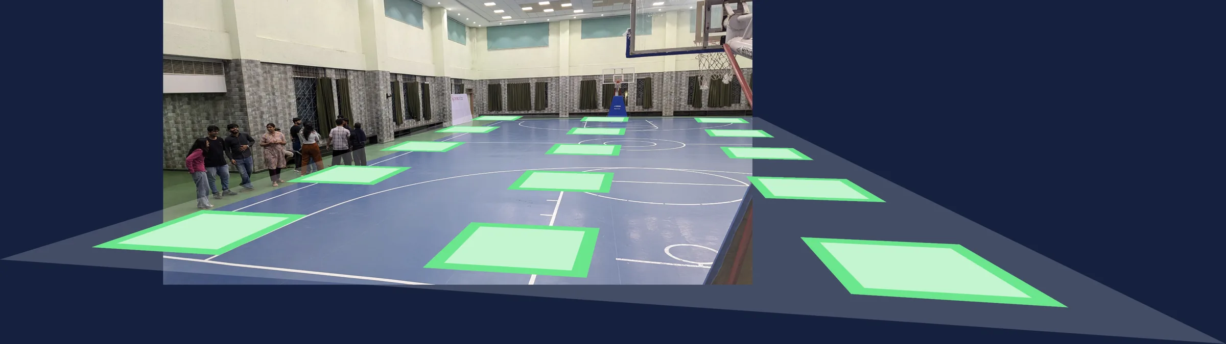Green booth footprints projected in perspective onto a photo of the empty hall