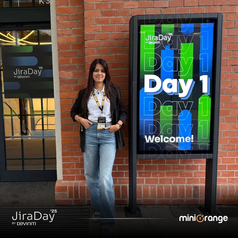 Jira Day 2025 “Day 1 Welcome” post with an attendee by the event sign